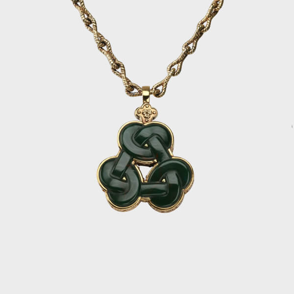 A bespoke Triskelion love knot pendant necklace made of yellow gold and green jade.
